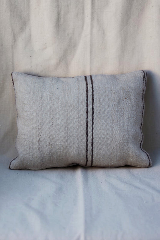 Second view of cream Moroccan cushion cover with narrow dark brown stripes and textured weave