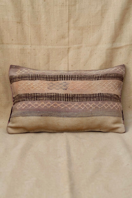 Moroccan cushion cover with muted mauve, pink and cream geometric bands and dark brown stripes, full front view