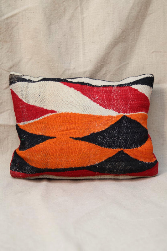 Moroccan cushion cover with bold orange, red, black and cream geometric shapes, full view