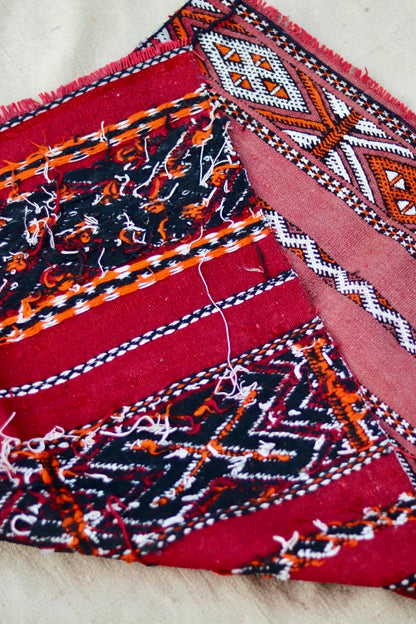 Folded Hanbel showing the patterned front and visible yarn ends on the reverse