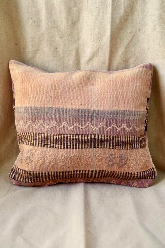 Moroccan cushion cover in blush pink, lilac and brown with geometric woven details