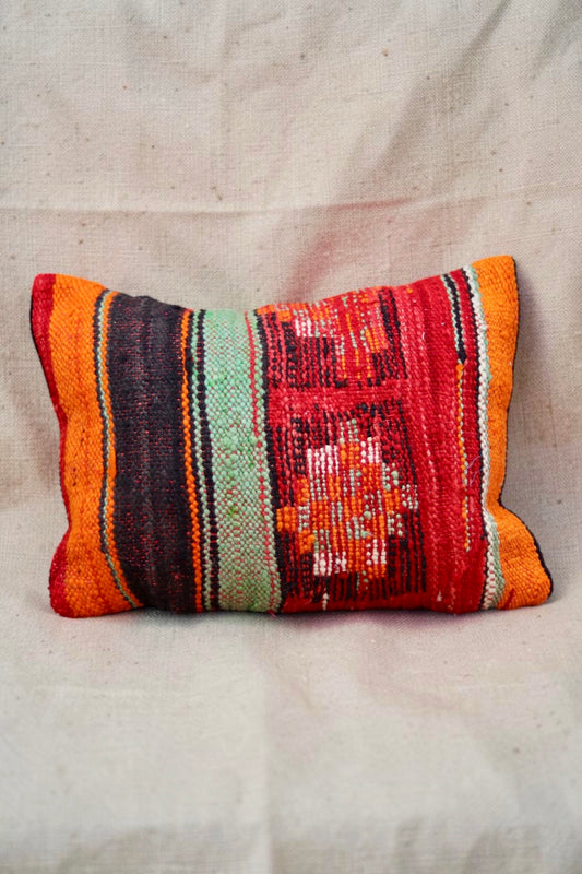 Moroccan cushion cover with red, orange, mint and charcoal stripes and woven motifs