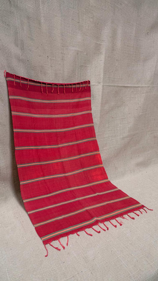 Angled view of the red striped vintage Moroccan flatweave rug
