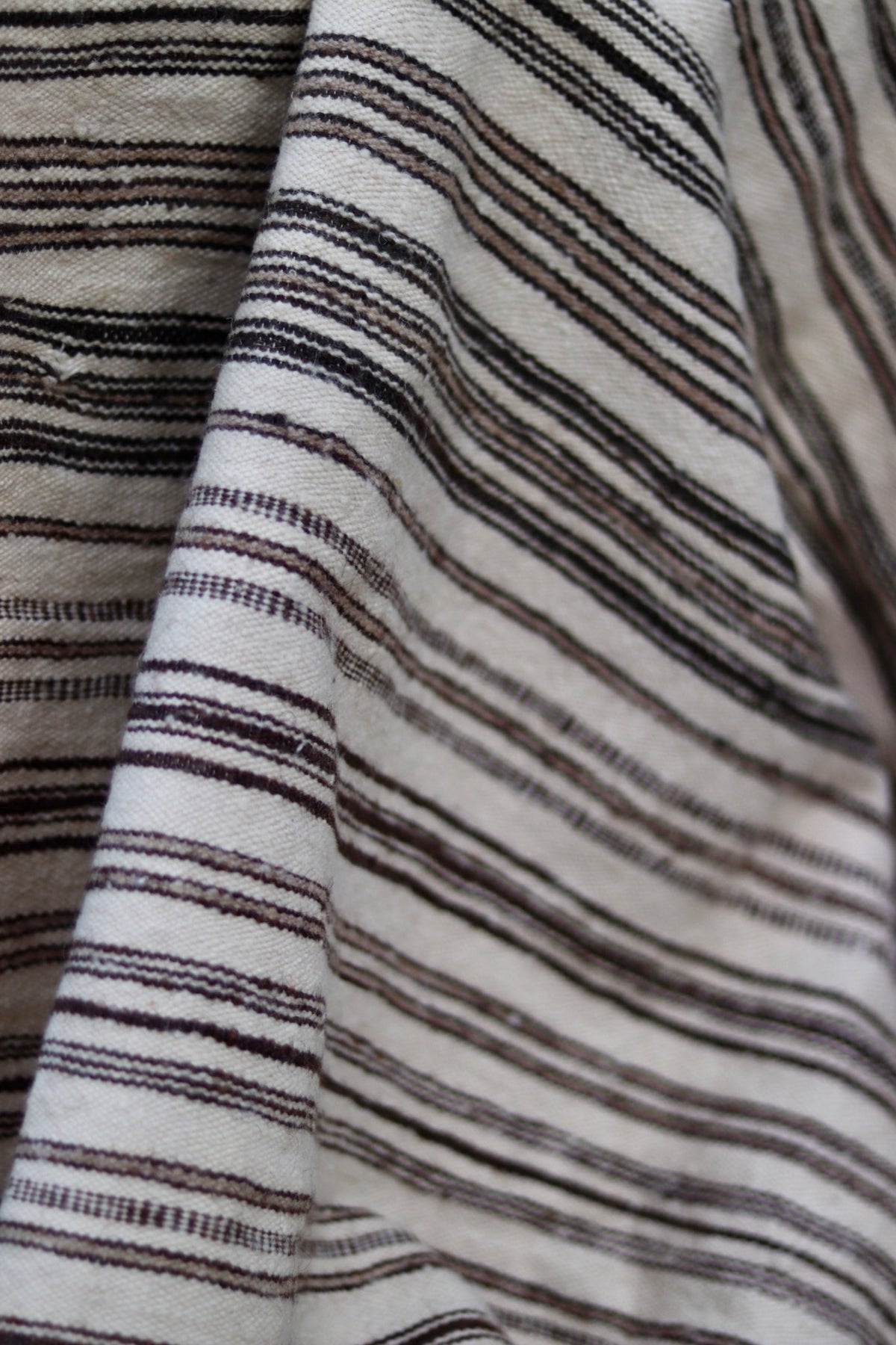 Close-up of the fine vintage weave and small loose threads