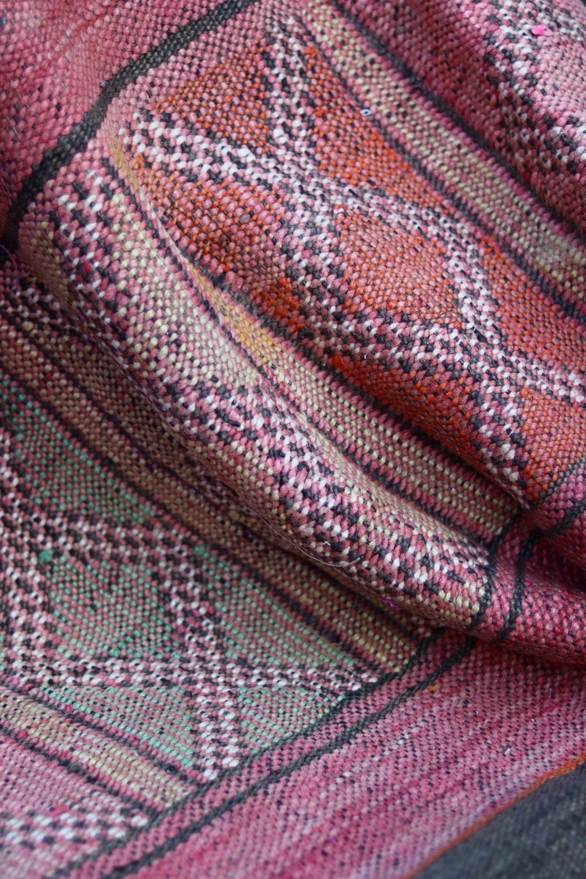 Folded vintage Hanbel showing muted orange, pink and cream diamond details