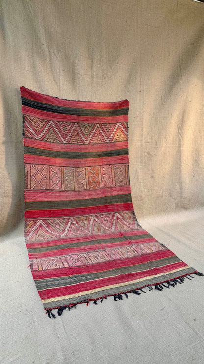 Vintage Moroccan Hanbel rug with faded red and charcoal stripes and geometric patterned bands