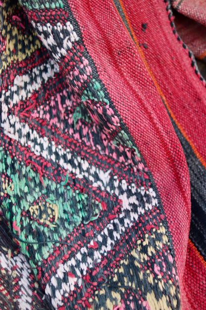 Reverse of the Hanbel showing colourful woven geometric motifs